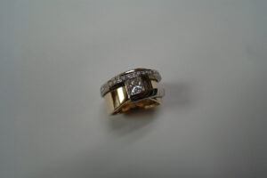 Princess Cut Diamond Ring in a Yellow and White Gold Diamond Setting