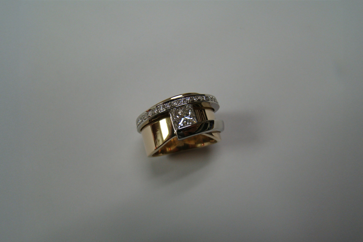 Princess Cut Diamond Ring in a Yellow and White Gold Diamond Setting