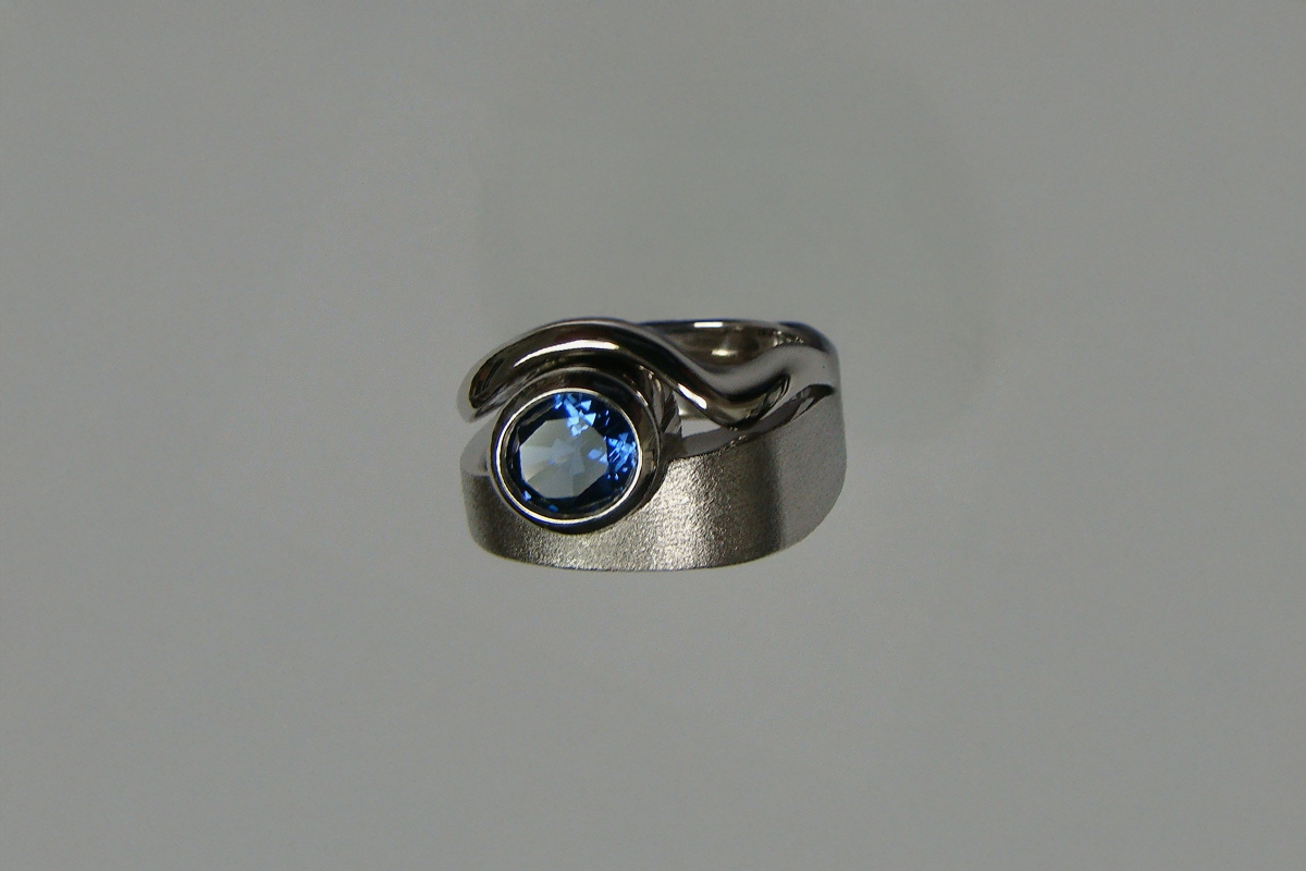 Oval Blue Sapphire Bezel Set in White Gold
