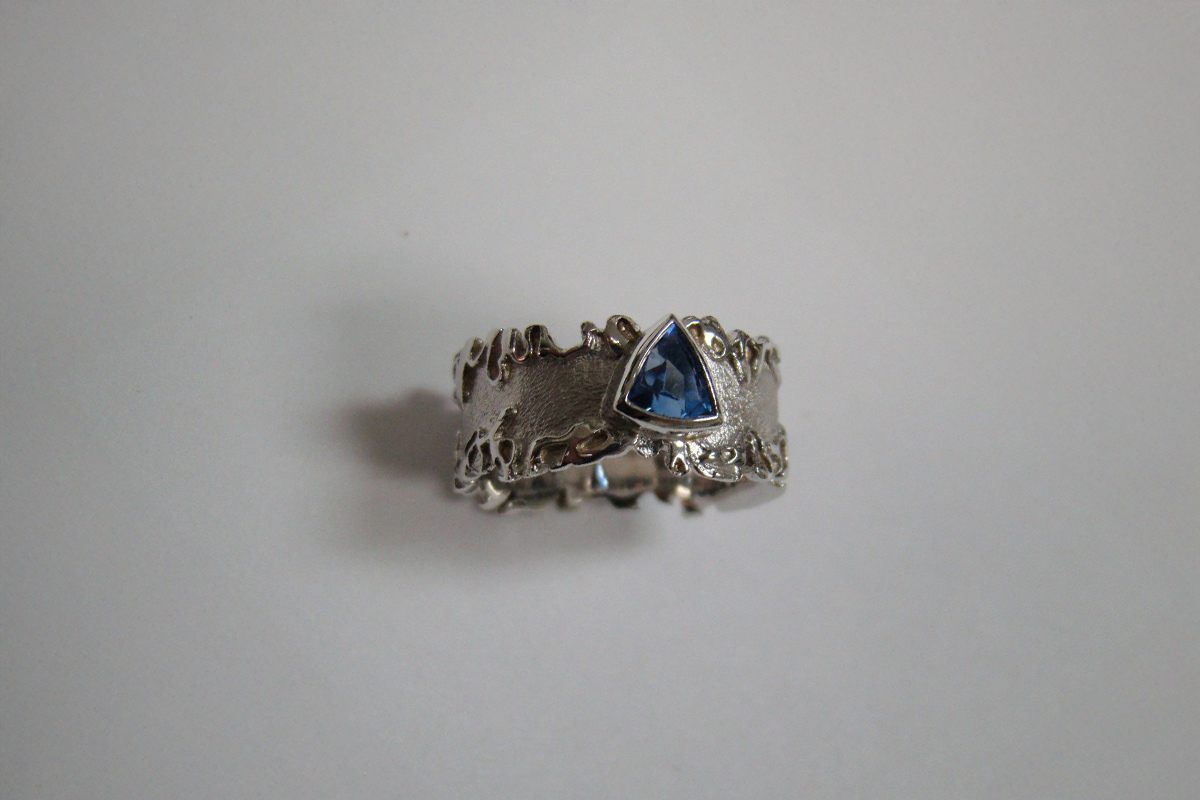 Blue Triangular Sapphire in Wavy Sterling Silver Band Ring