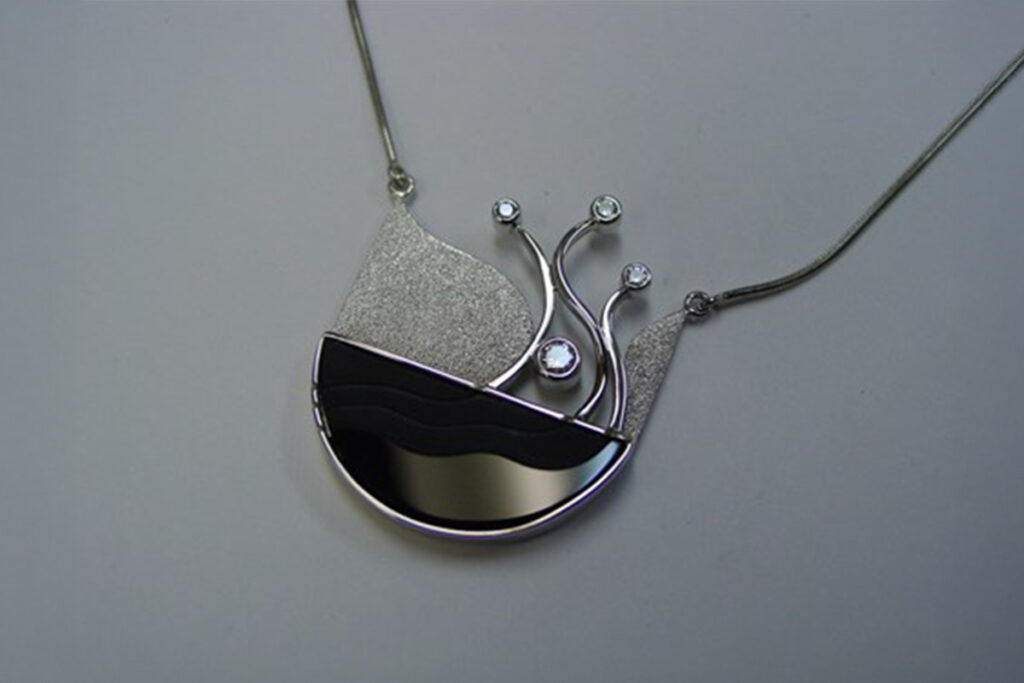 Rounded Onyx with Bezel Set Diamonds in White Gold