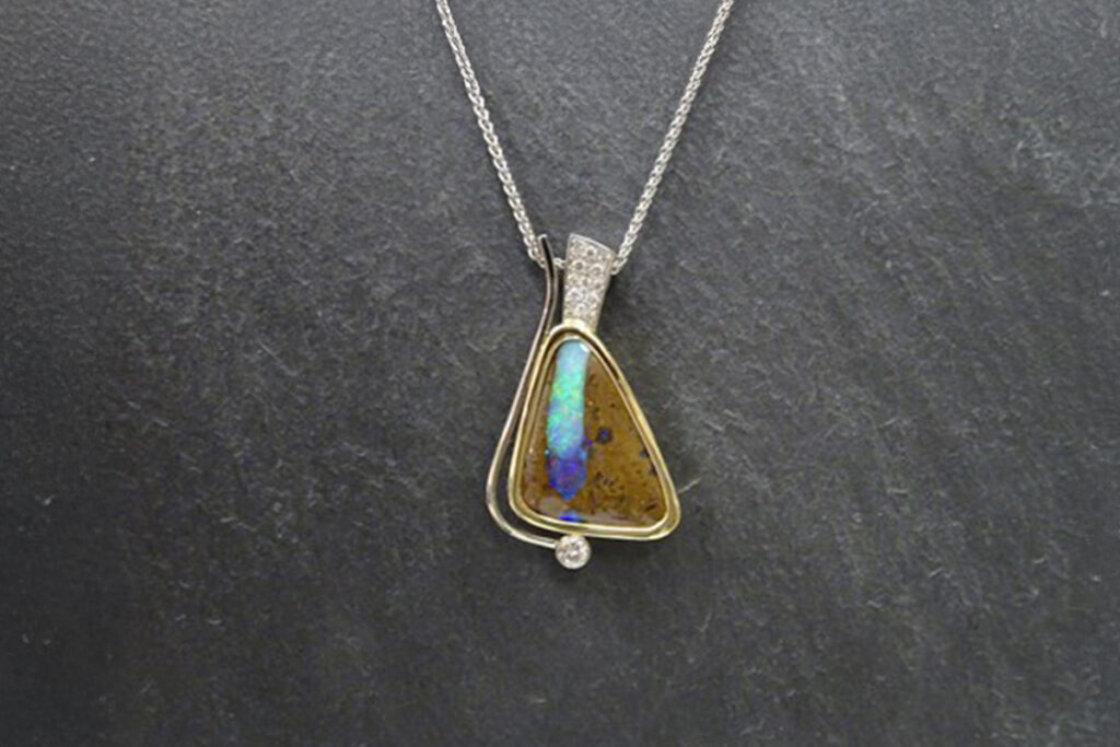 Boulder Opal in White & Yellow Gold with Pave Diamonds and a Bezel Set Canadian Solitaire Diamond