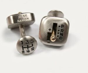 Automatic gearbox/stick-shift cufflinks with functional gear sticks in brushed and oxidized white and polished yellow gold.
