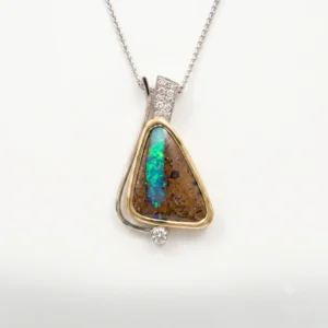 Heirloom pendant necklace with a teardrop-shaped turquoise and brown gemstone