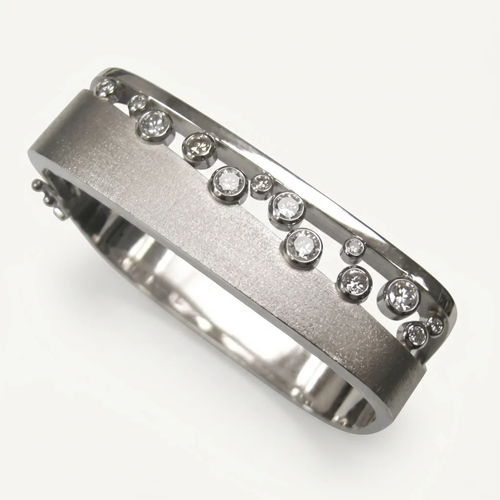 Brushed and Polished White Gold Bangle with Bezel Set Diamonds​
