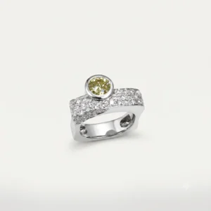 Silver gemstone ring with a round yellow stone and pavé diamond detailing